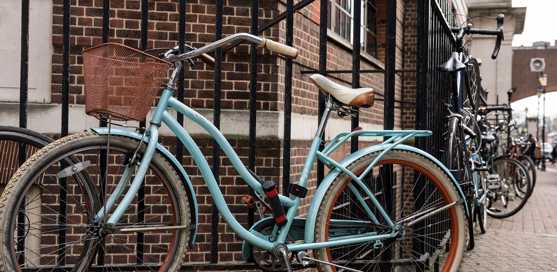 A bike locked against railings of the medical school